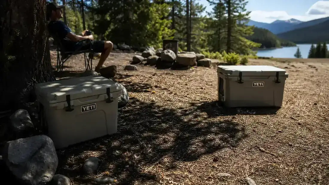 Coleman Classic cooler placed in shade under a camp tarp on a sunny Colorado day